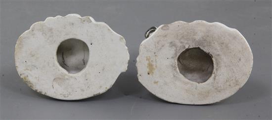 A pair of Derby figures of pug dogs, c.1760-5, h. 7cm, tails lacking